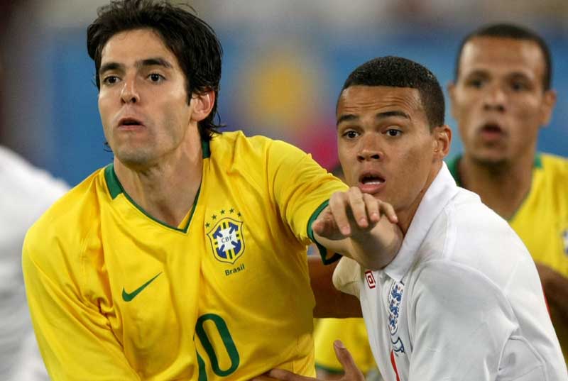 Jermaine Jenas closely marking Kaka during England's meeting with Brazil.